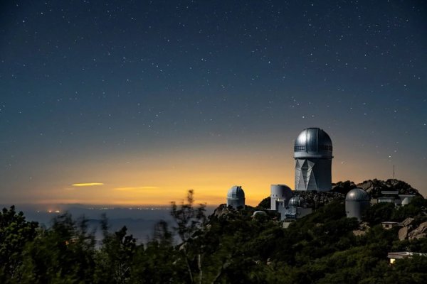 The Dark Energy Spectroscopic Instrument sits atop the Mayall 4-Meter Telescope at Kitt Peak National Observatory. DESI’s early data gathered in 2020 and 2021 is now publicly available. Credit: Marilyn Sargent/Berkeley Lab